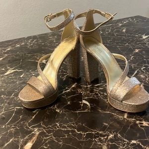 Sexy gold glittery Michael Kors platform shoes.